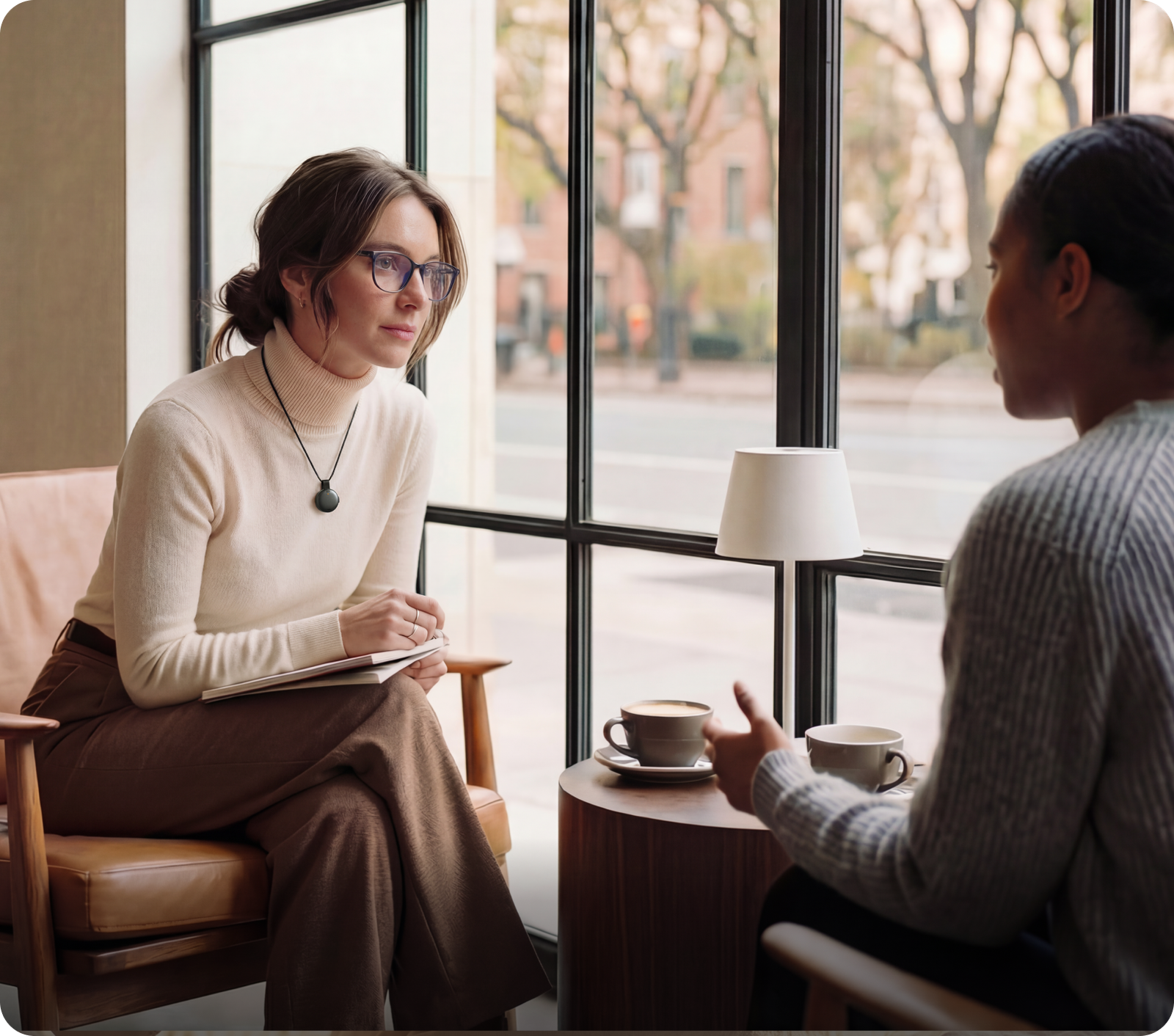 Interviewer wearing Soundcore Work as a pendant during a conversation